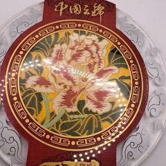 Vintage Chinese fabric in a glass plate