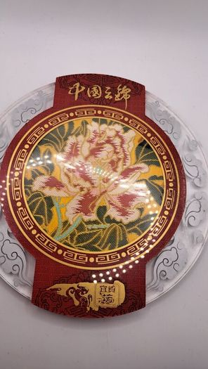 Vintage Chinese fabric in a glass plate