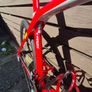 Trek Madone SL6 rim brake in vibrant red. Image 7