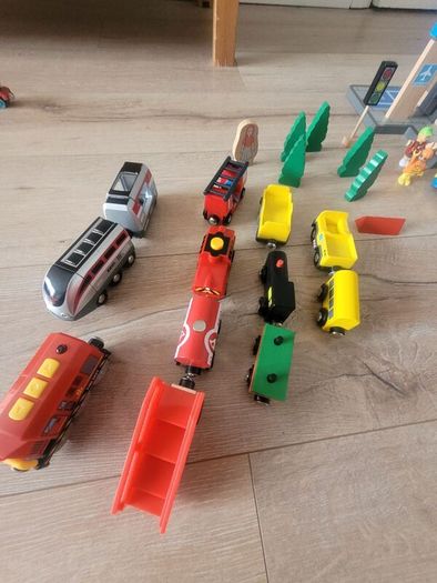 wooden train play set with two electric locomotives and lots of parts
