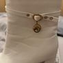 Women's white heeled boots with gold design Image 4