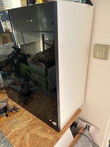 ikea cabinet with black smoked glass door