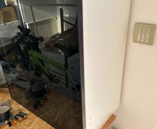 ikea cabinet with black smoked glass door