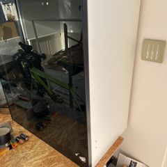 ikea cabinet with black smoked glass door