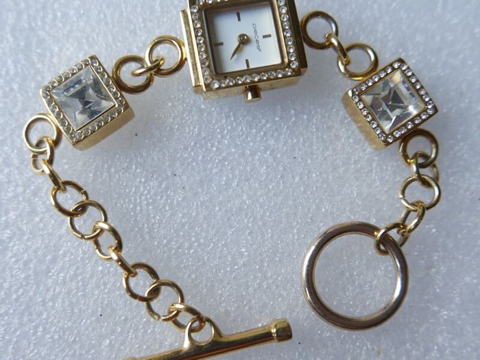 Pieces gold tone bracelet watch with crystal detail