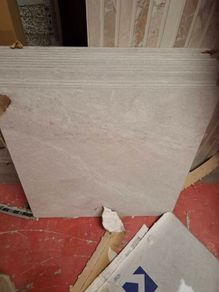 Durstone.  5.76m2 60x60 tiles light grey