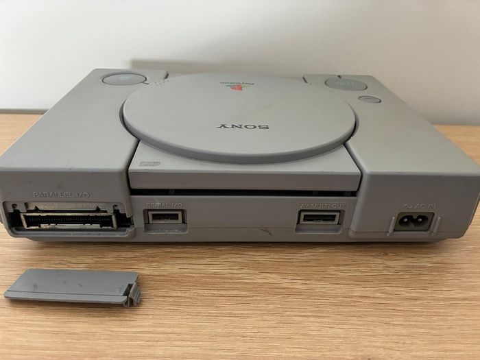 PlayStation console, Dual Shock controller, and all cables