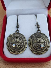 Round antiqued style brass tone metal dangle earrings