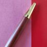 Handcrafted  Rosewood ballpoint pen with gold trim Image 2
