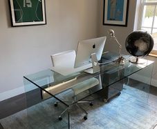 Modern glass desk with integrated drawer unit