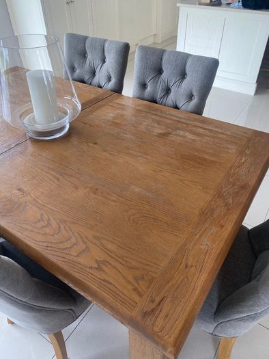 Solid oak dining table and chairs