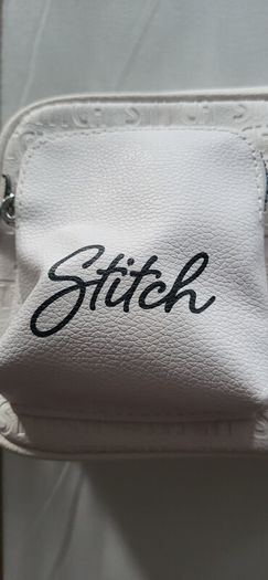 Stitch crossbody bag with matching purse.