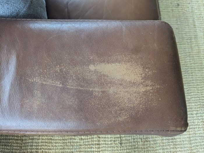 Brown faux-leather two-seater sofa
