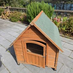 Wooden pet house with green felt roof