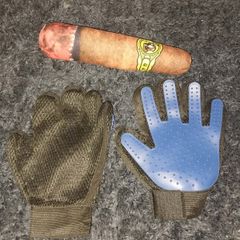 A pair of pet grooming and deshedding glove and Cigar designed toy for dogs