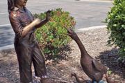 Bronze girl with ducks water feature
