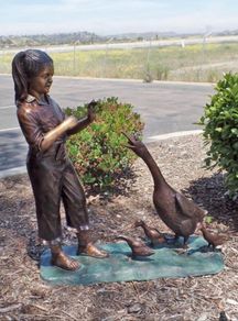 Bronze girl with ducks water feature
