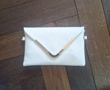Beige clutch with gold accents