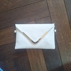 Beige clutch with gold accents