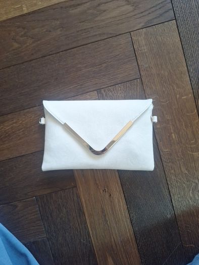 Beige clutch with gold accents