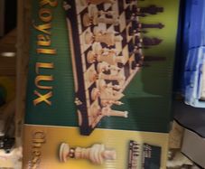 A stunning box of wooden chess pieces and board