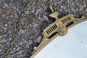 Antique oval overmantle with brass surround