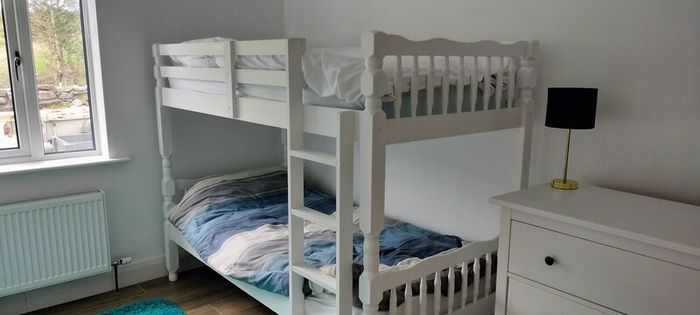 single wooden bunk bed. White