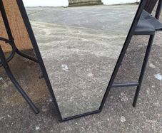Black heavy metal framed mirror