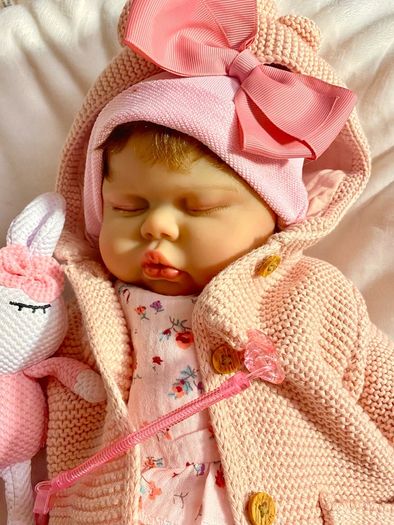 doll.       Reborn baby doll very cute COMES WITH A XMAS OUTFIT