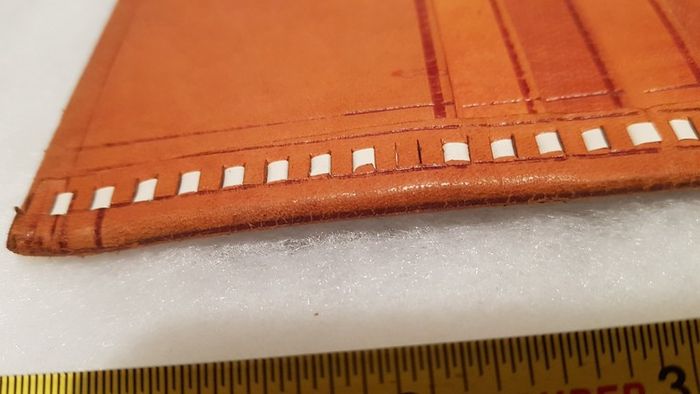 handcrafted made soft leather wallet,with designs ,, thank you,,was used,some wear and tear,,take as is ..