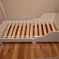 White wooden toddler bed