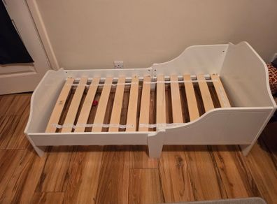 White wooden toddler bed
