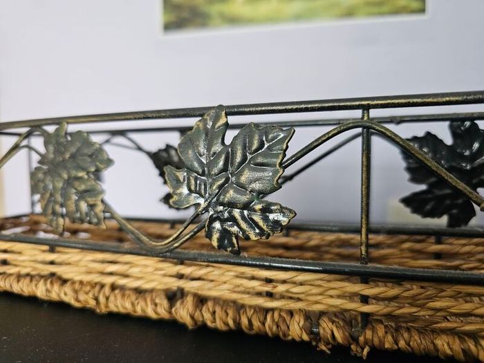Decorative metal and wicker tray in good condition.