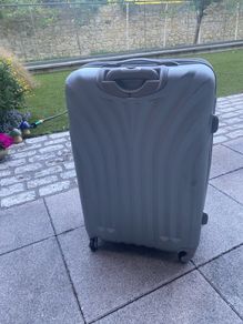 Large, hard shell family suitcase