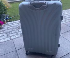 Large, hard shell family suitcase