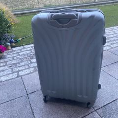Large, hard shell family suitcase