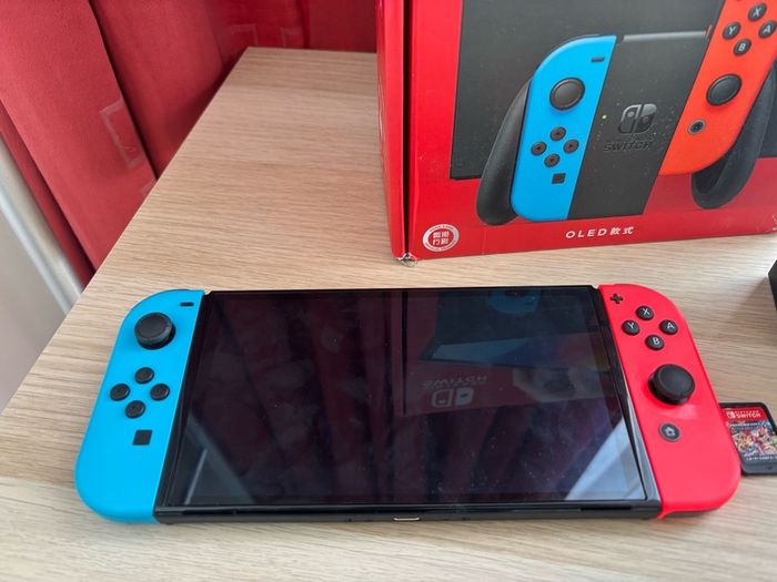 Nintendo Switch OLED (Neon Blue/Red) + Mario Kart 8 Deluxe + Super Mario Bros. W