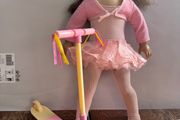 American Girl doll with OG toy scooter