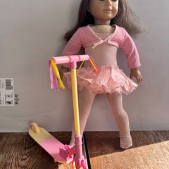 American Girl doll with OG toy scooter