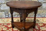 Early 20th Century solid oak gate leg drop leaf table.