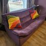 Unique Purple Curved Sofa & Yellow Accent Chair with Rainbow Cushions Image 3