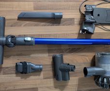 Dyson V6 handheld vacuum cleaner with charger and accessories