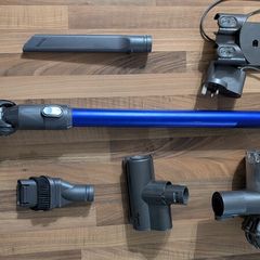 Dyson V6 handheld vacuum cleaner with charger and accessories