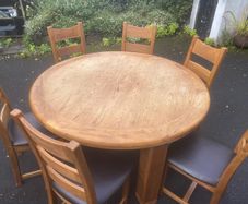 Large round solid timber table & chairs