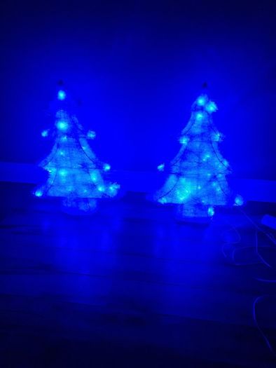 2 blue plug in Christmas trees.