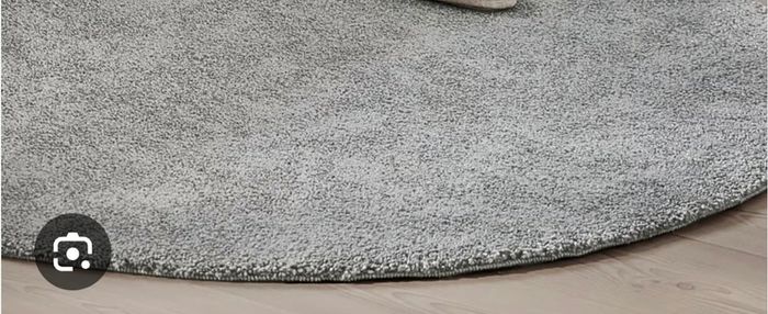 Round grey rug