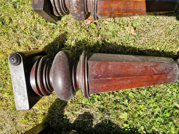 Antique mahogany piano legs with bronze casters