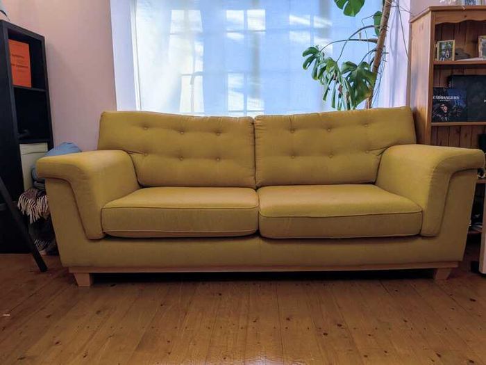 Stylish yellow couch / sofa