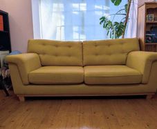 Stylish yellow couch / sofa