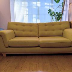 Stylish yellow couch / sofa